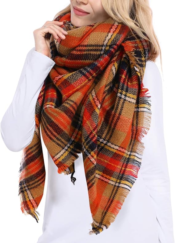 A woman wearing a multicolored plaid scarf in a tartan pattern, wrapped around her shoulders.