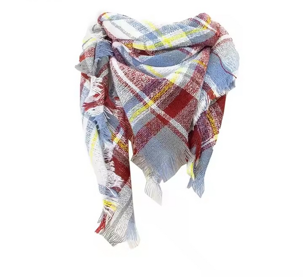 A multicolored plaid scarf with twisted tassels, predominantly red and blue with fringe at the ends.